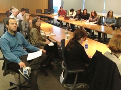 Event Attendees Around Conference Table